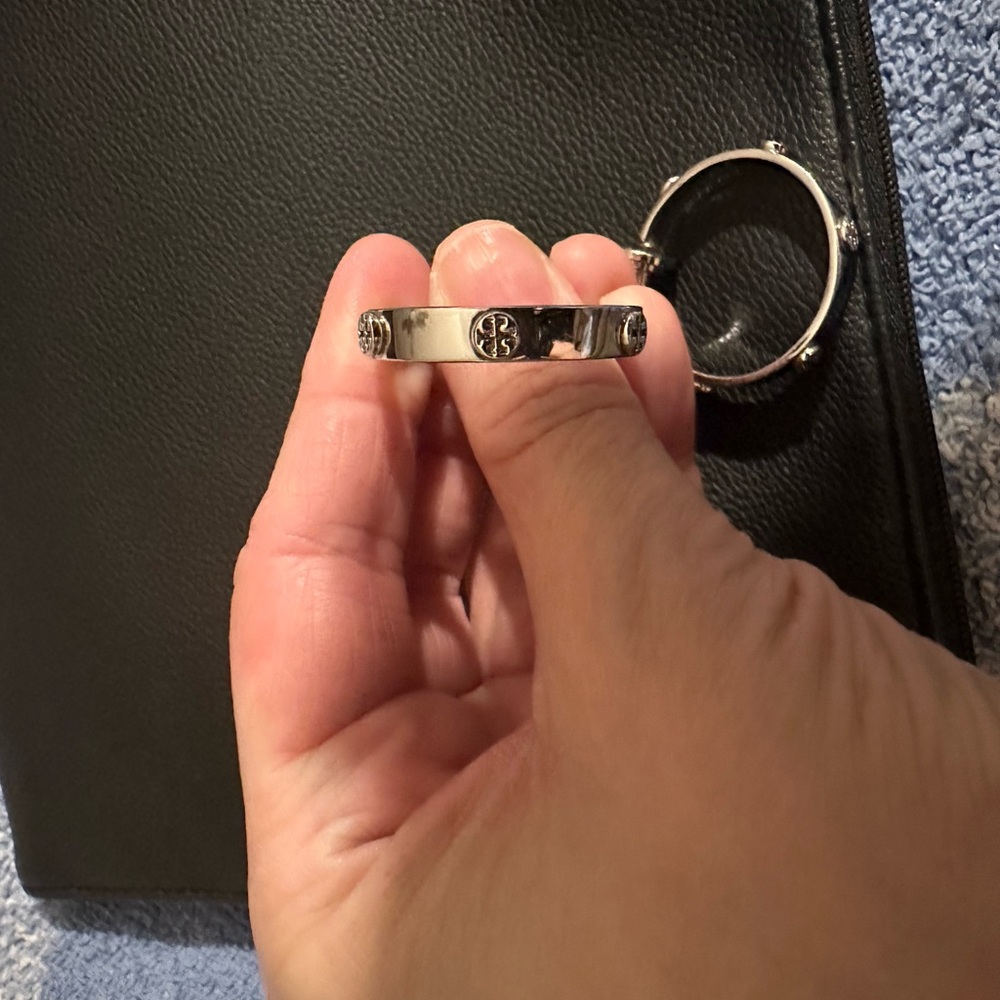 Tory Burch Silver hoops with logo. These were worn lovingly.